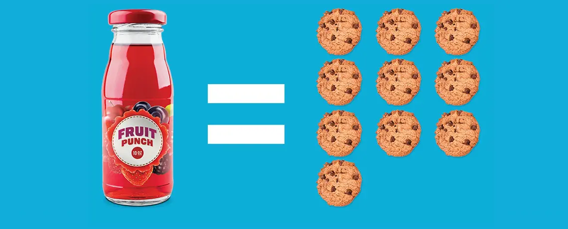 A bottle of juice is shown next to cookies.